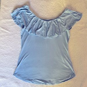 Blue ruffle boat neck top. Soft fabric. Slightly stretchy.